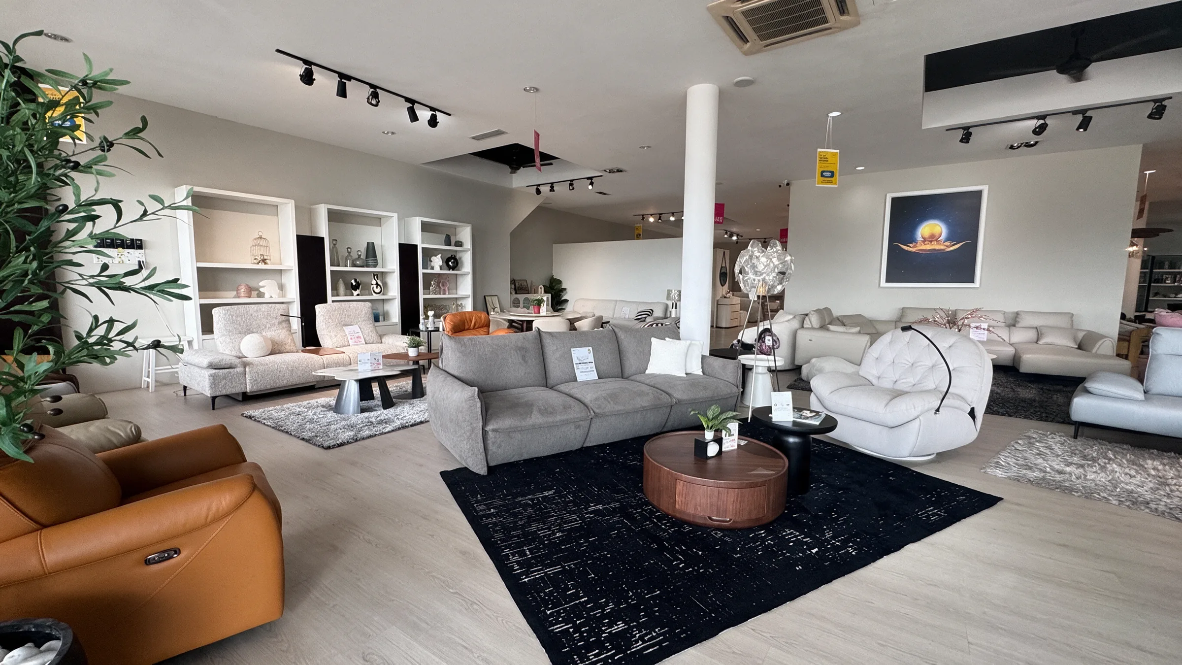 Inside our Kluang showroom on Jalan Mersing, with sofas, dining sets and fabric samples